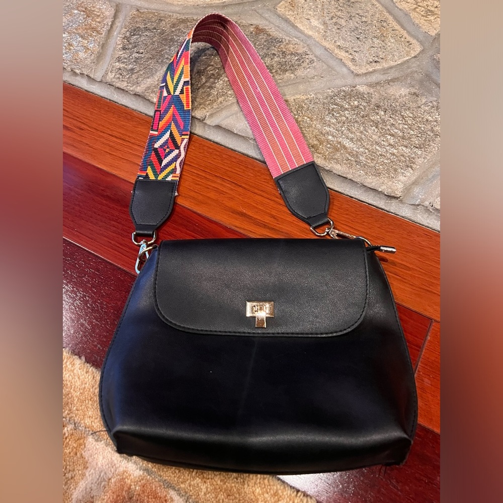 Black purse with reversible strap